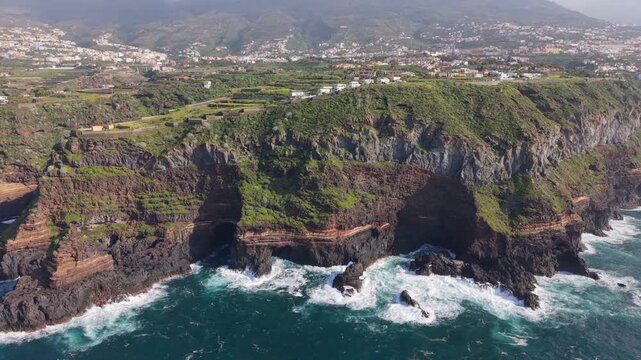 Aerial drone footage of the stunning coastal cliffs of Santa Ursula in North Tenerife, Spain, overlooking the Atlantic Ocean
