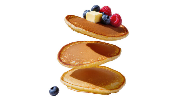 Stack of golden pancakes with butter blueberries and raspberries, isolated on transparent background