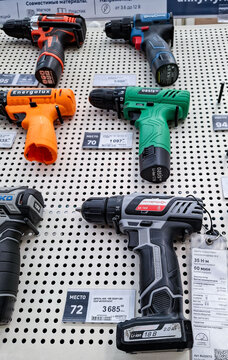 Voronezh, Russia - April 8, 2026.Colorful power tools on display at a Russian hardware shop during daylight in an organized manner