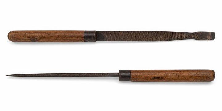 Old woodworking files and rasp tool with wooden handles on a white background.