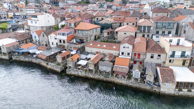 Traditional h&oacute;rreos lining combarro village shoreline in galicia