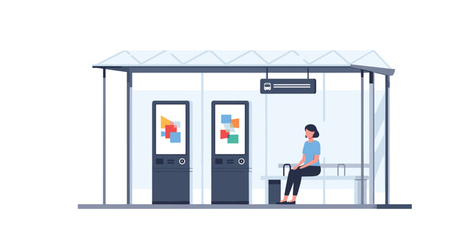 A lone woman sits quietly on a bench inside a sleek minimalist bus shelter that features two bright digital information kiosks for transit schedules.