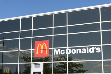Obraz premium exterior building and sign of McDonald's, a fast food restaurant, located at 2525 St Clair Av W, inside Walmart Supercentre, Toronto