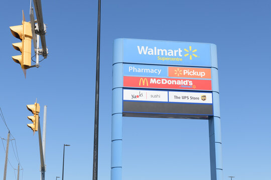 road side pylon sign of Walmart Supercentre, a department store chain, located here at 2525 St Clair Av W inside SmartCentres Toronto