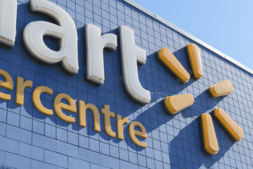 Obraz premium abstraction of exterior building and sign of Walmart Supercentre, a department store chain, located here at 2525 St Clair Av W inside SmartCentres Toronto
