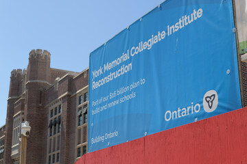Naklejka premium Gov of Ontario blue banner outside reconstruction of York Memorial Collegiate Institute, a TDSB senior high school, located at 1700 Keele St, Toronto