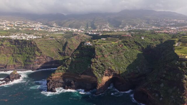 Aerial drone footage of the stunning coastal cliffs of Santa Ursula in North Tenerife, Spain, overlooking the Atlantic Ocean