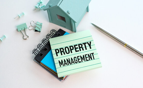Property management concept shown clearly. Pastel notes, clips, and a tiny house symbolize organization. Stationery and tools hint at professional tasks.