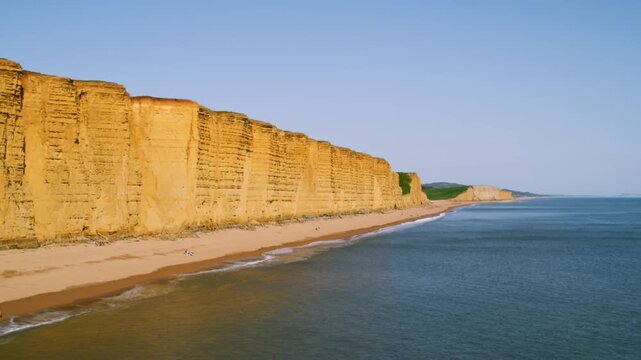 Aerial view of the West Bay cliffs along the stunning Jurassic Coast in Dorset during sunset