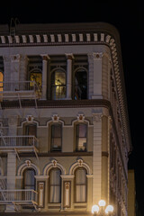 Historic Ornate Building Facade at Night with Street Lamp © Robert
