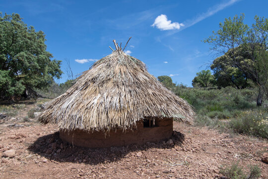 Palm thatched adobe brick hut in Spain