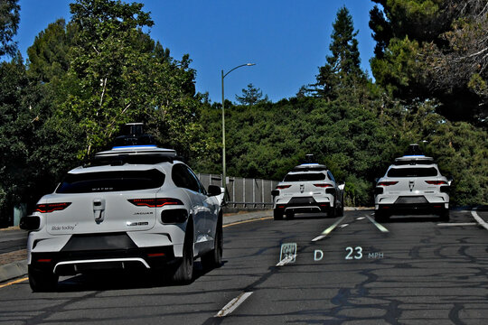 The spinning cylinder on the roof of Waymo cars is a LiDAR (Light Detection and Ranging) sensor. It serves as the primary "eye" of the self-driving car.