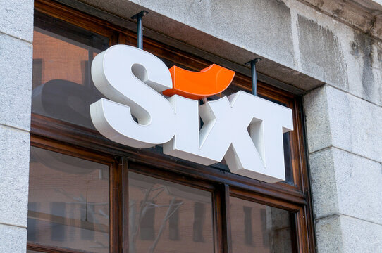 Sixt rent a car official corporate logo sign on a building facade