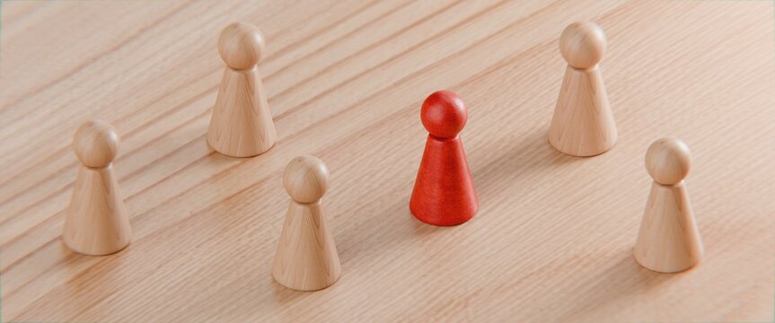 3d pawn figurines on a solid colour background with one highlighted in red, inclusion, individuality, business background