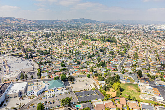 
Rowland Heights, California CA September 12, 2024: High Aerial City Drone View toward Fairway Dr, Colima Rd, Shopping Mall with Townhouses, Homes, Houses, Community, Streets, Roads, Cityscape