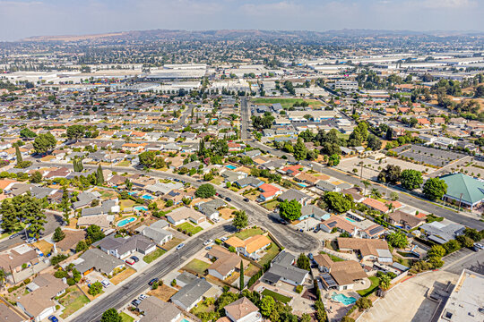 
Rowland Heights, California CA September 12, 2024: High Aerial City Drone View toward Fairway Dr, Colima Rd, Shopping Mall with Townhouses, Homes, Houses, Community, Streets, Roads, Cityscape