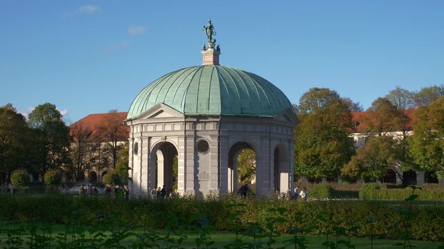 sunny day munich city central park famous rotunda exterior garden slow motion panorama 4k germany 