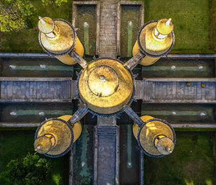 Aerial view of the historic Fonte da Manga featuring its unique golden domes and symmetrical water fountains in Coimbra, Coimbra, Portugal.