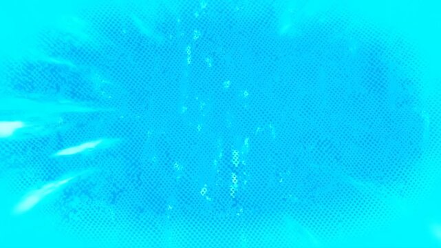 Slow motion static shot of particles and bubbles drifting and rising in turquoise underwater environment with glowing light streaks
