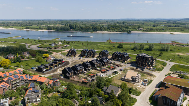 Espel, Netherlands - 04 April 2026: Aerial drone view of a large battery park near Windpark Noordoostpolder, showing renewable energy storage, grid balancing, containers and transformers.