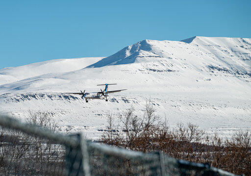 Icelandair Dash 8 Q400 airplane landing at the airport