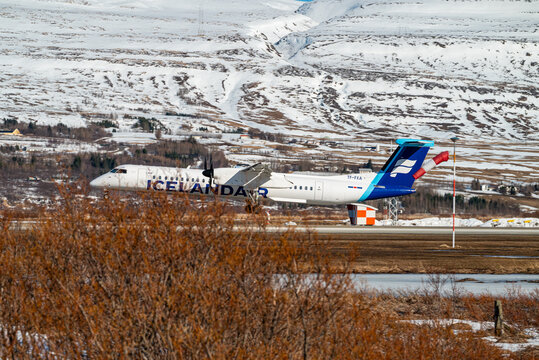 Icelandair Dash 8 Q400 airplane landing at Akureyri airport in north Iceland