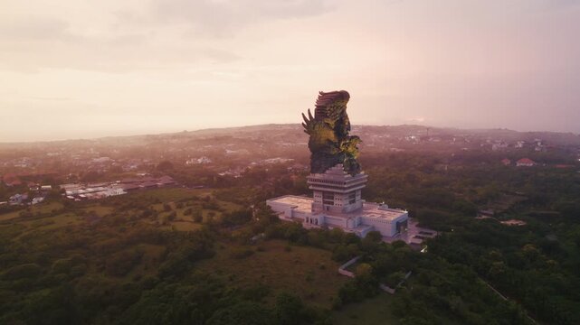 Aerial view of Garuda Wisnu Kencana cultural park at sunset