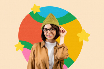 Obraz premium Happy Young Woman With Glasses And Green Beanie Smiling While Posing Against Colorful Background, Displaying Joy And Positivity In Lifestyle Setting. Capturing Lightheartedness And Fun Concept