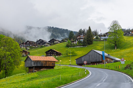 Beatenberg village road winding through foggy Swiss Alps