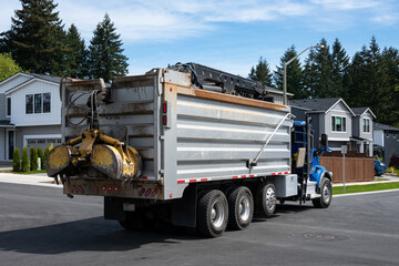Specialized Grapple Truck with grapple loader knuckle boom secured on back of truck, heavy duty industrial truck to empty dumpsters and remove waste and garbage  © knelson20