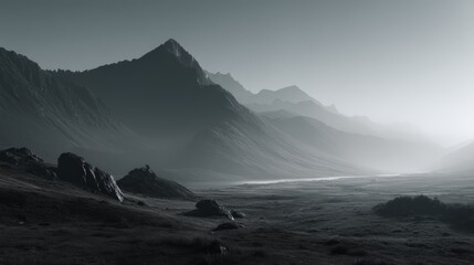 Obraz premium A monochrome photo of jagged mountain peaks fading into a misty, expansive valley under a bright sky, abstract combo green background for kids