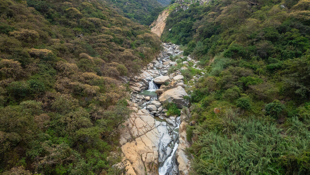 Panoramic aerial photo of the rocky river and crystal clear waters at the waterfalls, near the Laquipampa Wildlife Refuge, Lambayeque, Peru