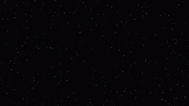 Twinkling white stars on black background, seamless celestial starfield 4k video