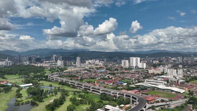 sunny day flight over kuala lumpur cityscape traffic road overpass golf court park aerial panorama 4k malaysia   