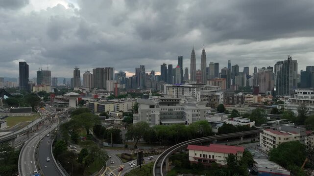 cloudy sky twilight time kuala lumpur city downtown district traffic road aerial panorama 4k malaysia    