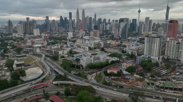 twilight time illumination kuala lumpur city downtown district traffic road interchange aerial panorama 4k malaysia    