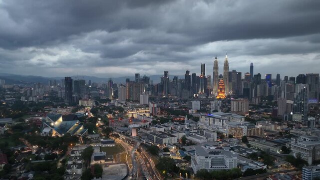 twilight time illumination flight over kuala lumpur city traffic downtown exterior aerial panorama 4k malaysia    