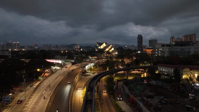 twilight illumination kuala lumpur city traffic road interchange famous museum exterior aerial panorama 4k malaysia    