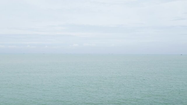 Watch the view of nuoc ngot pass from the pier during daytime with water and sky in sight