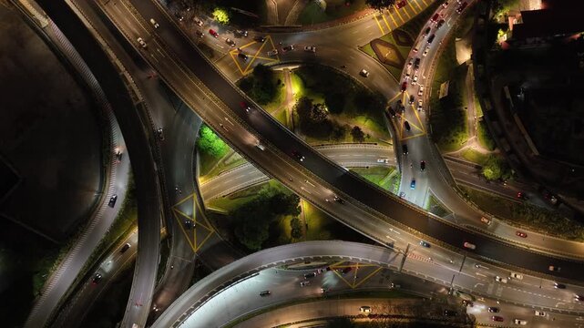 night illumination flight over kuala lumpur city traffic street road interchange aerial topdown panorama 4k malaysia  