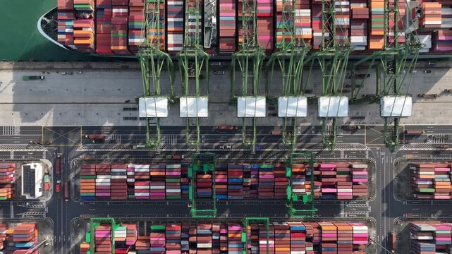 day time singapore city port terminal container ship loading working cranes bay aerial topdown panorama 4k    
