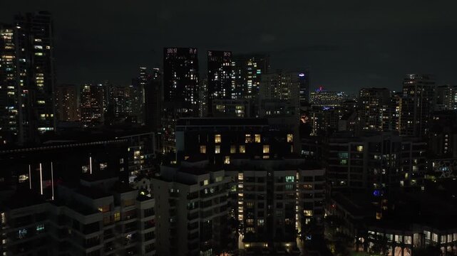 night time singapore city residential apartment buildings exterior aerial panorama 4k 