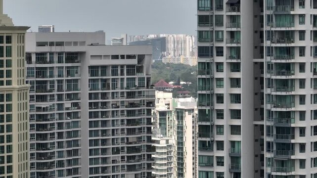 day time singapore city residential apartment buildings exterior aerial panorama 4k 