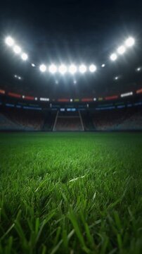 Close up football field grass illuminated by stadium floodlights during night game