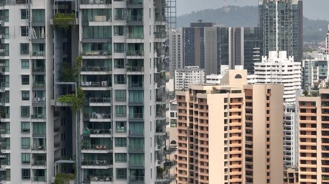 day time singapore city residential modern apartment buildings balcony front exterior aerial panorama 4k 