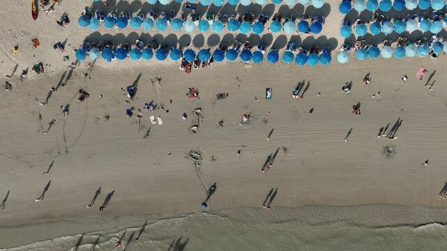 day time phuket island famous kata crowded beach bay coastline aerial topdown panorama 4k thailand