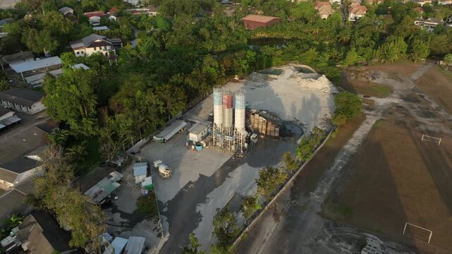 sunset time phuket island concrete factory working outside exterior aerial panorama 4k thailand