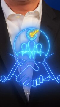 Cooperation concept, act or instance of working or acting together for a common purpose or benefit. Businessman shows glowing neon line of handshake with businessman icon on virtual screen.