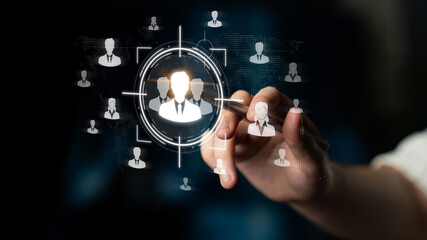 Naklejka premium Hand Holding Pen Targeting Virtual Network of Business Persons in Futuristic Digital Environment Representing Connection and Collaboration Sigmoid