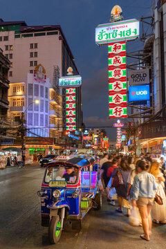 Blue tuk-tuk parked on Yaowarat Road at Chinatown of Bangkok